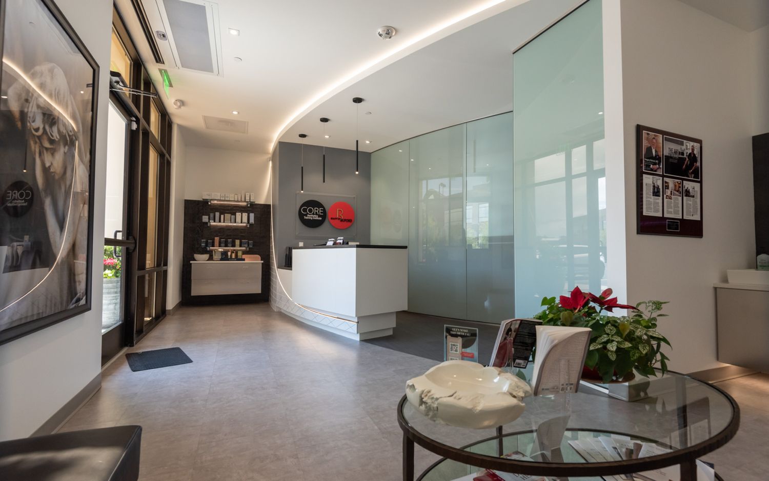 Denver plastic surgeon's modern reception area with plant and decor.